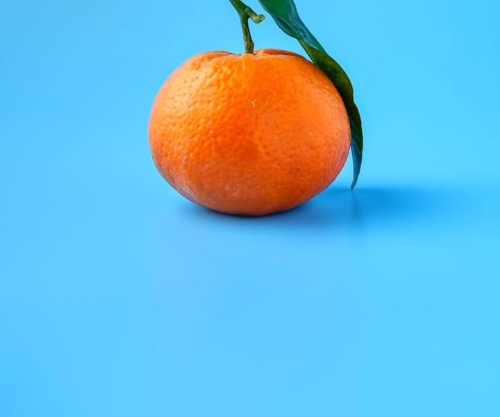 orange close up on a blue background